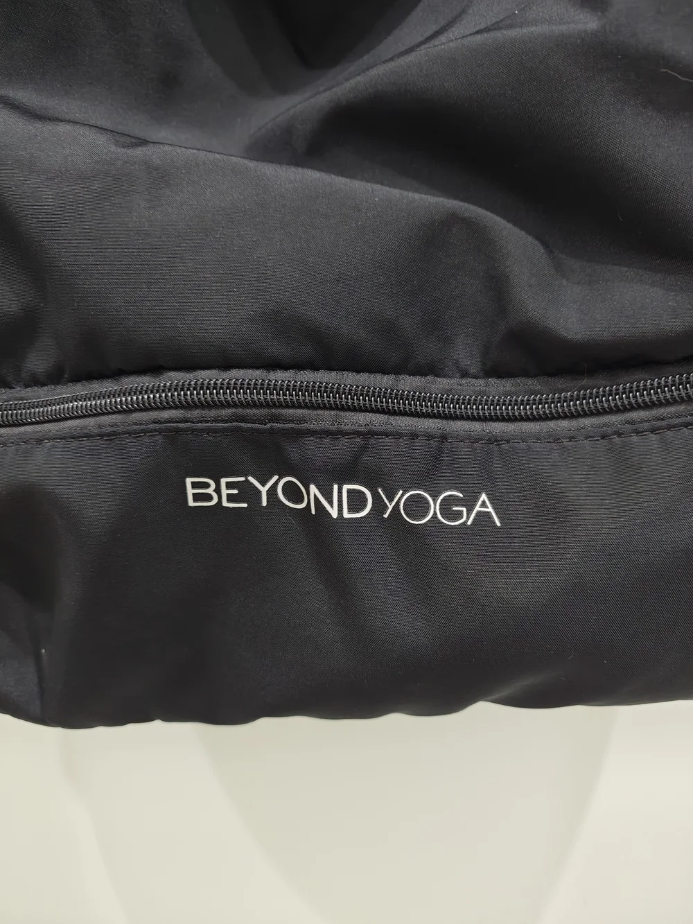 Beyond Yoga Black Convertible Drawstring Backpack with Front Zip Compartment